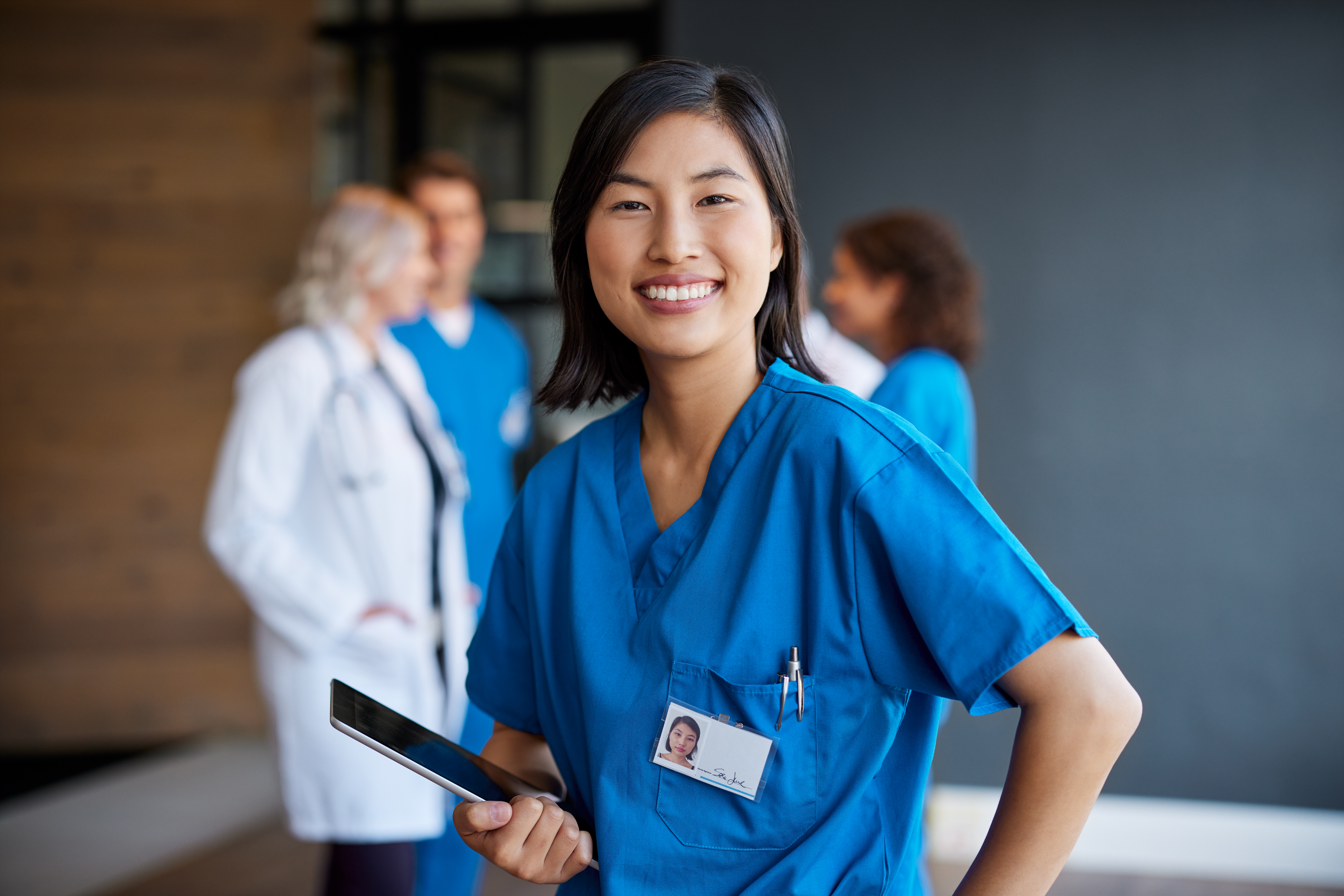 Portrait of smiling chinese-american intern looking at camera