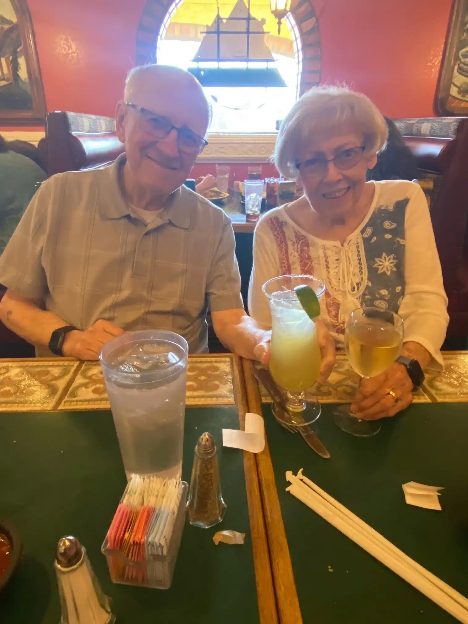 Senior couple with drinks at a restaurant