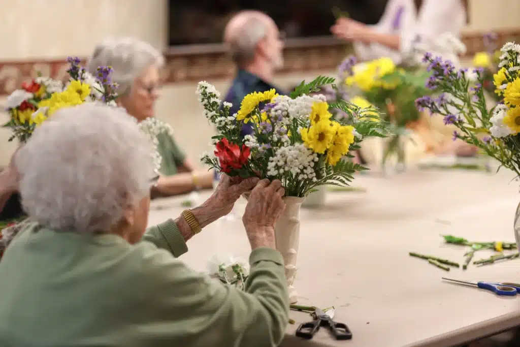 Seniors arranging flowers