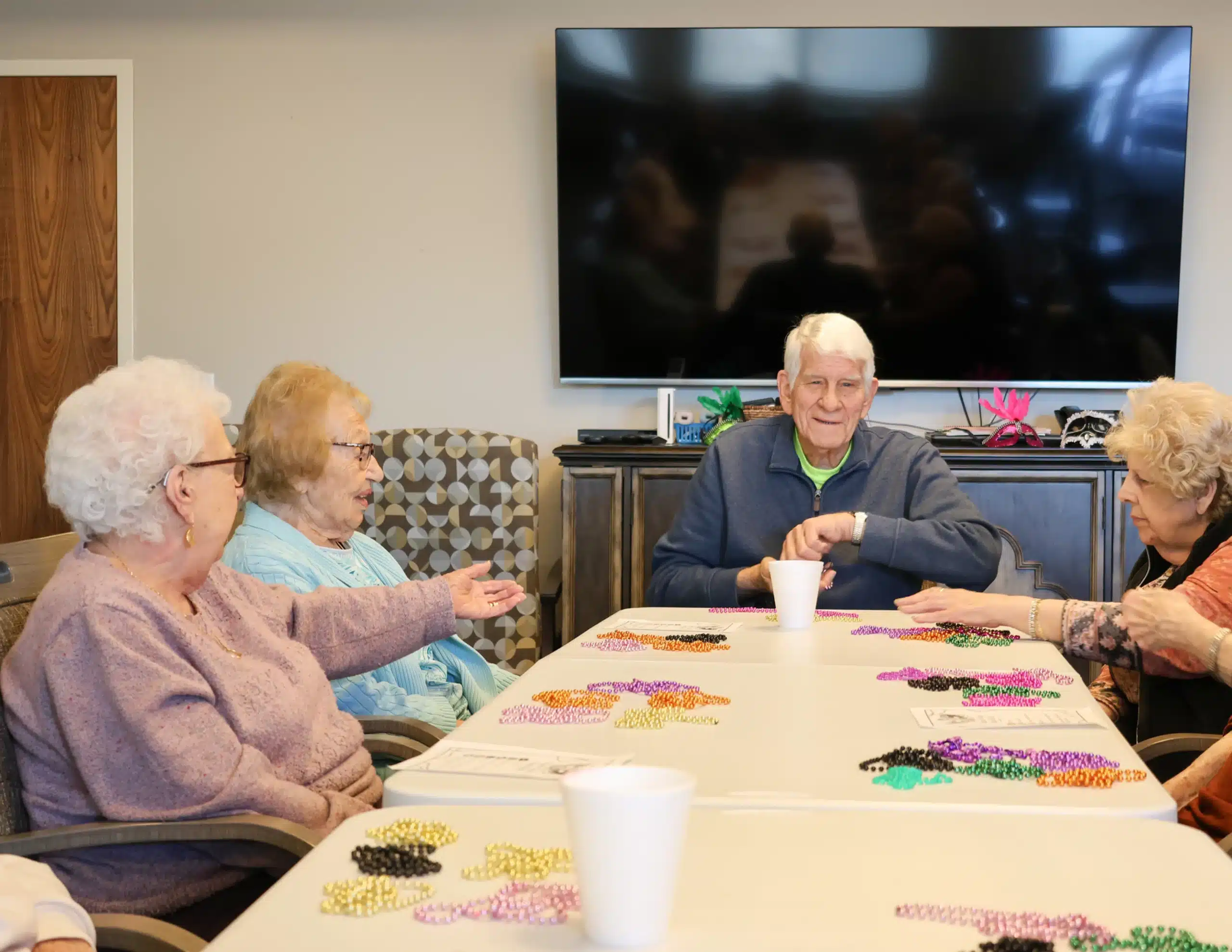 Seniors making beaded jewelry